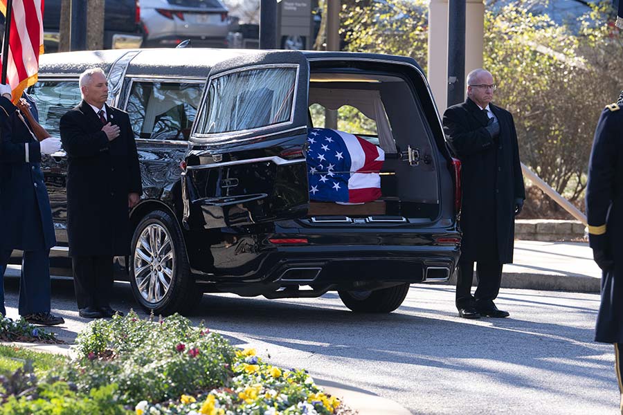 Casket seen in the back the hearse.