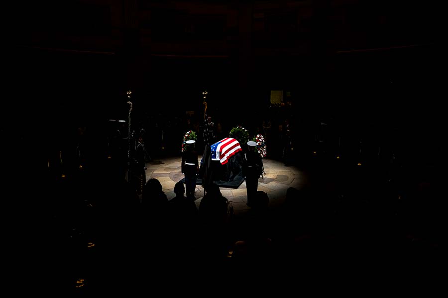 President Carter’s casket rests in the darkened Capitol Rotunda
