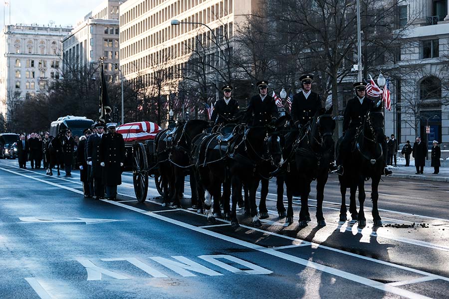 President Carter's casket atop a horse-drawn caisson