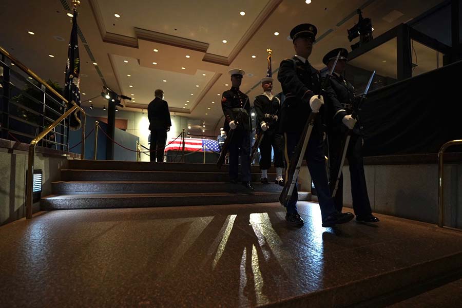 Military honor guard departs.