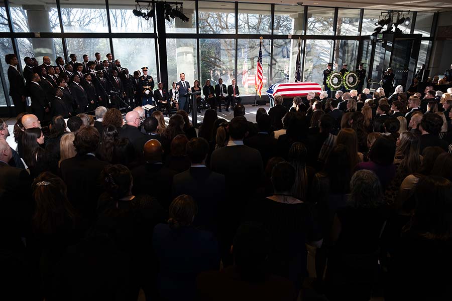 Jason Carter addresses mourners.